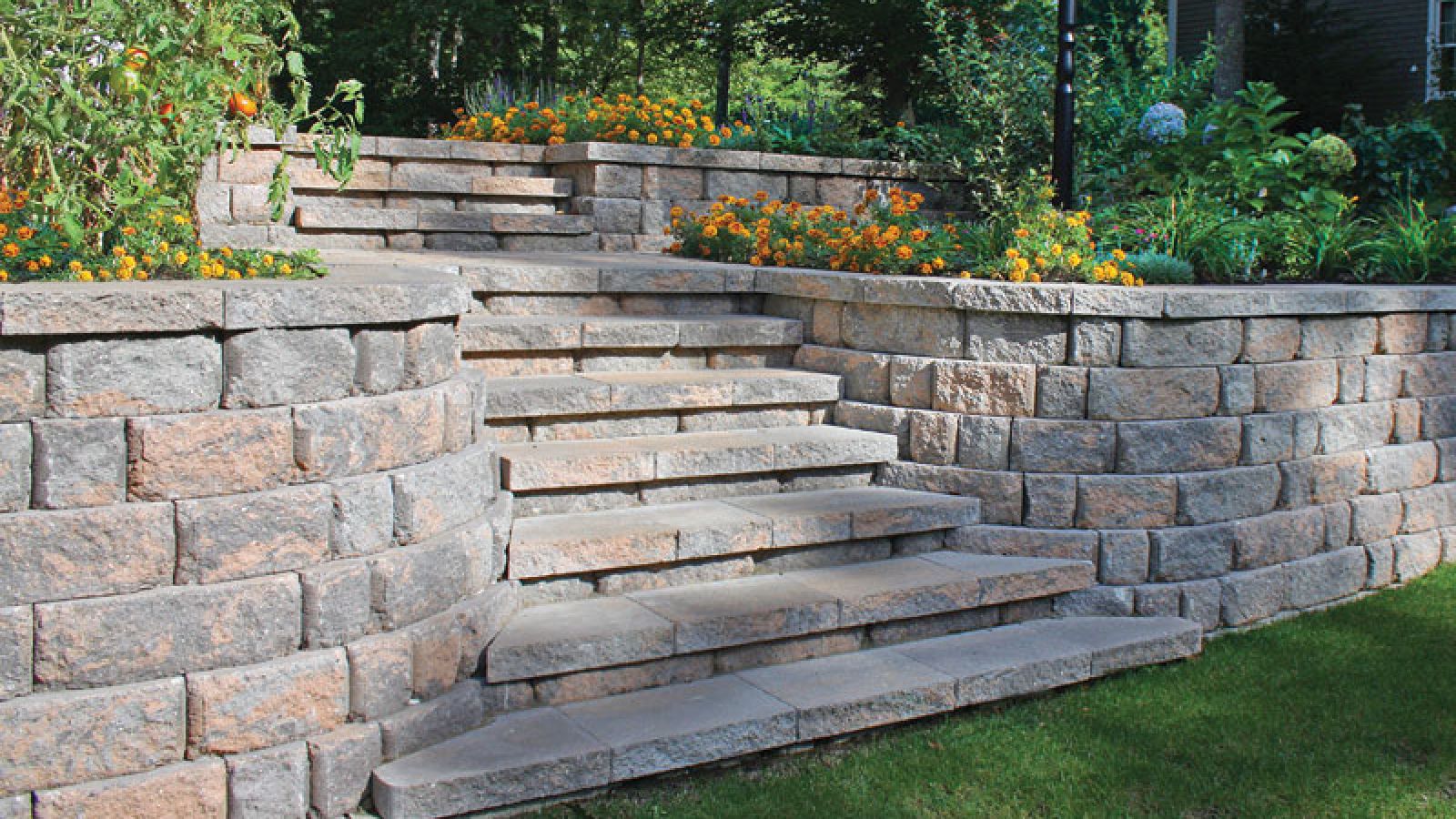 Elevate your hardscape projects with our precision-crafted Cap units. AR Pools • Stoneworks & Outdoor Living's Cap units on a retaining wall