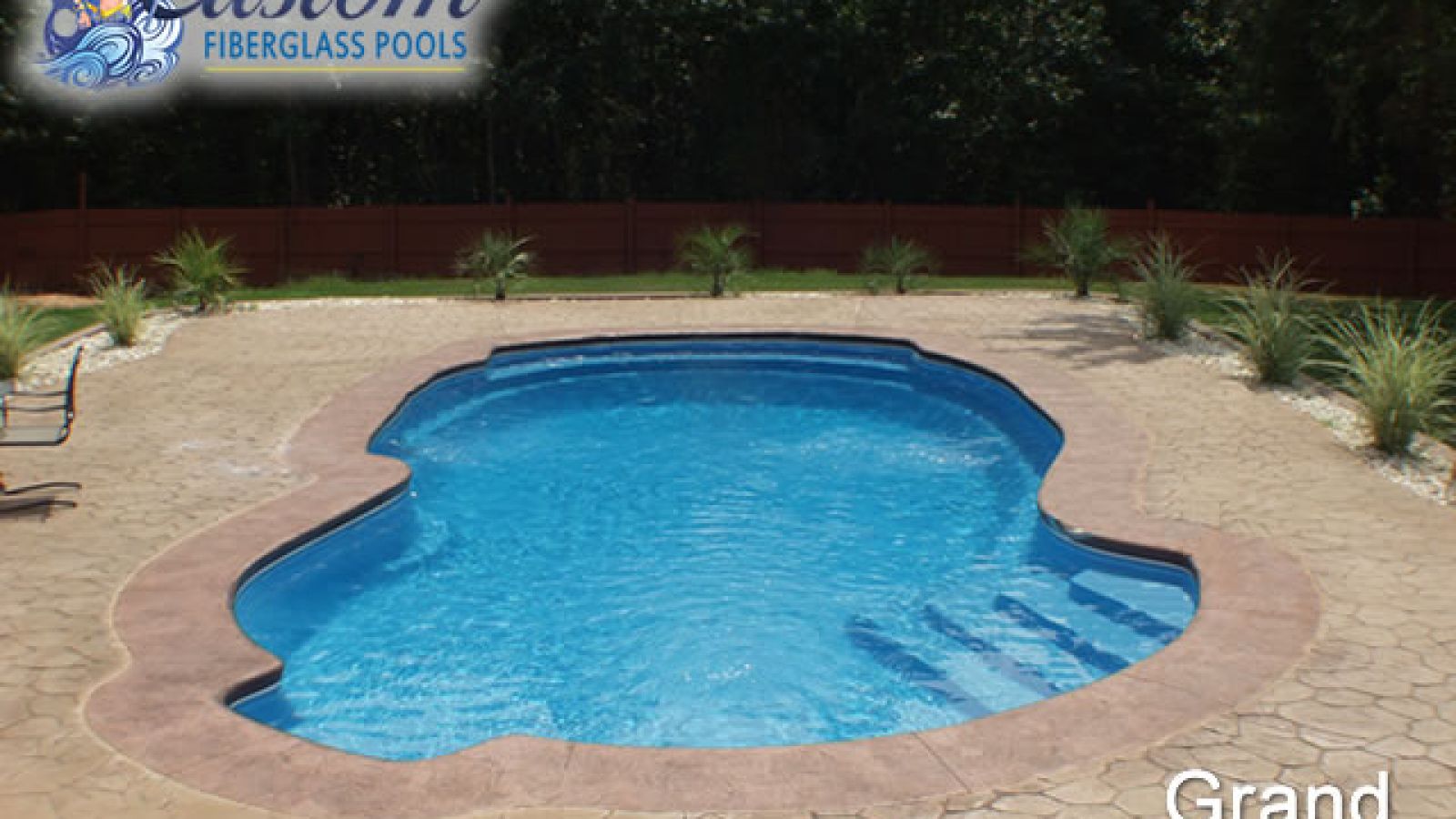 Grand Cayman Freeform Fiberglass Pool, a luxurious addition to a Clarksville, TN backyard