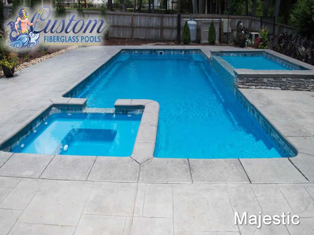 Majestic Fiberglass Pool with Spa creating a tranquil backyard oasis at AR Stoneworks, Clarksville TN