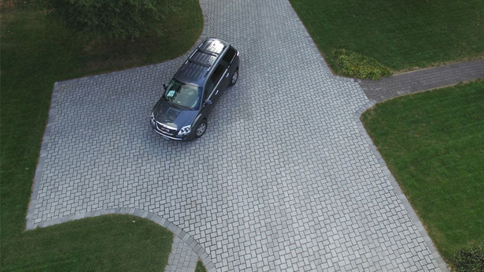Enviro-Flo™ Permeable Pavers laid in a herringbone pattern by AR Stoneworks & Outdoor Living.