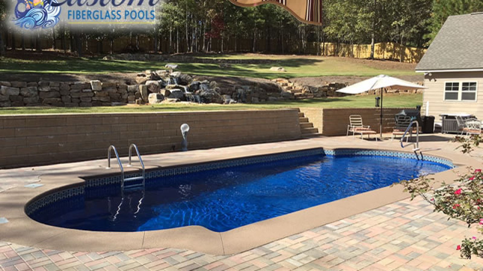 Riviera Roman Fiberglass Pool, a spacious and elegant addition to a Clarksville, TN backyard