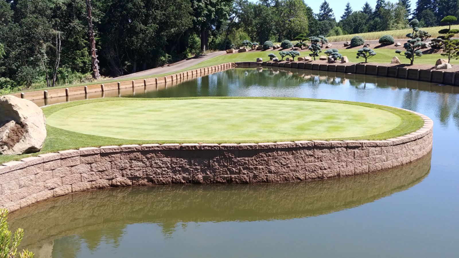 Keystone Compac® Retaining Wall units by Keystone Hardscapes, on display at AR Pools • Stoneworks & Outdoor Living, highlighting its straight split face design.
