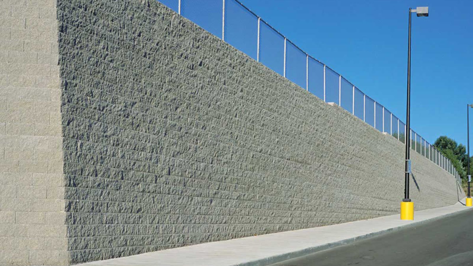 Keystone Standard® Retaining Wall blocks by Keystone Hardscapes, elegantly displayed at AR Pools • Stoneworks & Outdoor Living, showcasing its distinct split face design.