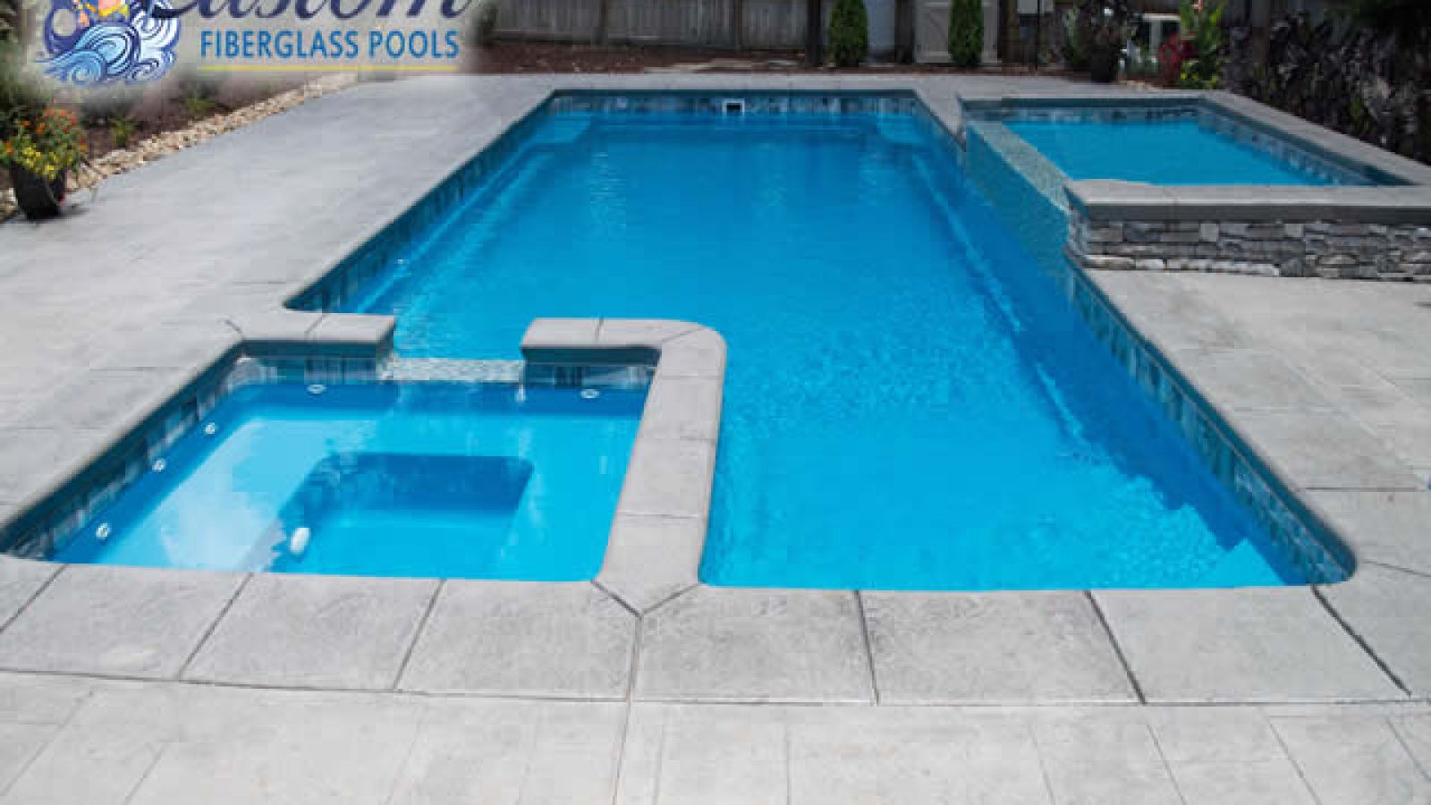 Majestic Fiberglass Pool with Spa creating a tranquil backyard oasis at AR Pools, Clarksville TN