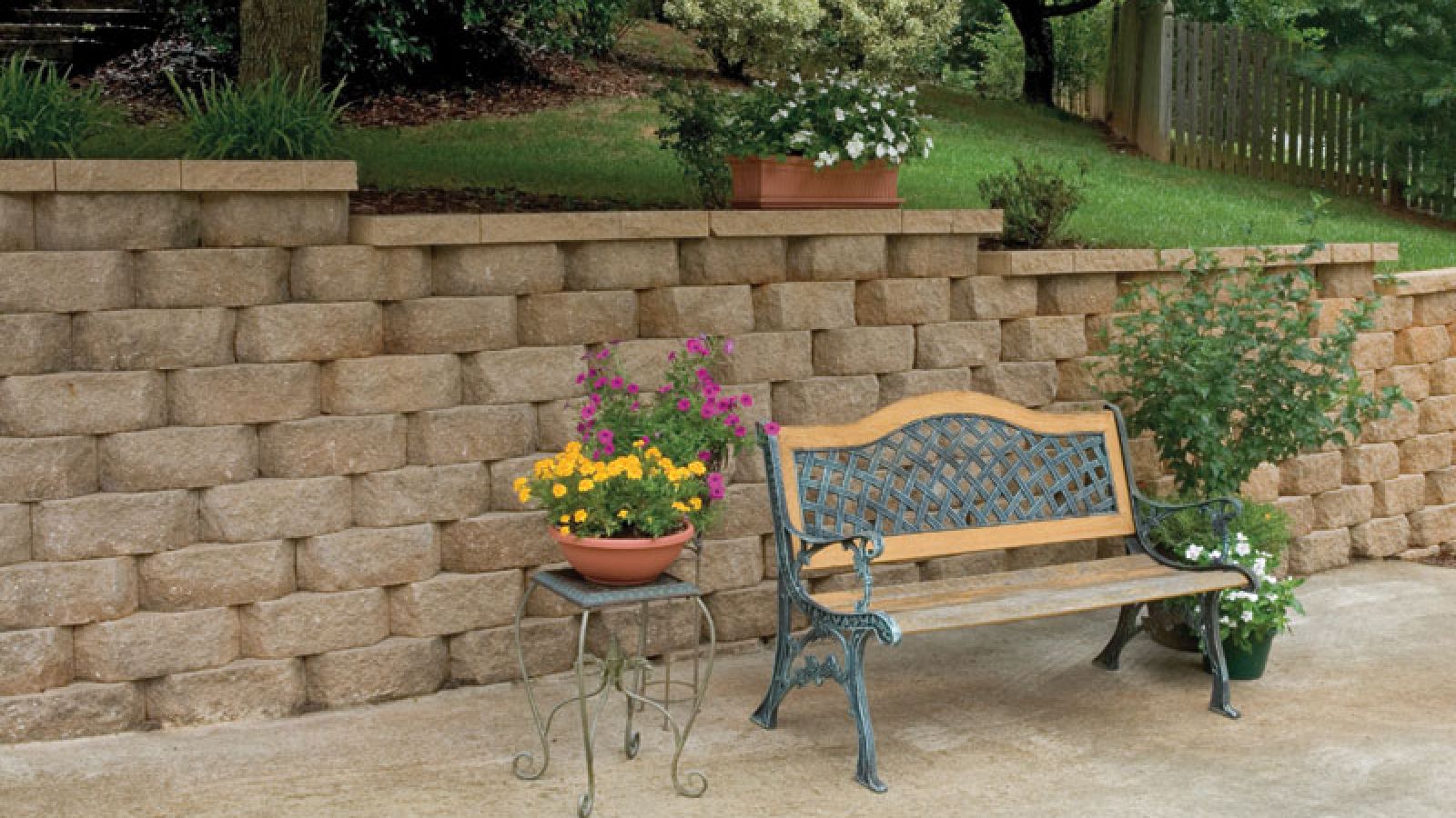 Legacy Stone® Retaining Wall blocks by Keystone Hardscapes, a masterpiece at AR Pools • Stoneworks & Outdoor Living, emphasizing its striated Deco split design.
