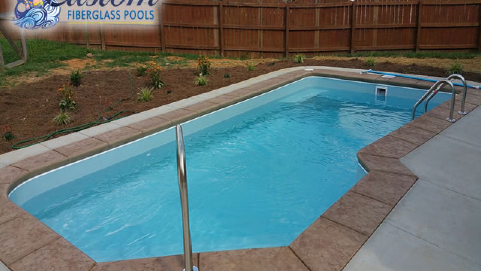 The Mediterranean Pool: A Blend of Style and Relaxation Mediterranean Custom Fiberglass Pool, a sleek and modern addition to a Clarksville, TN backyard