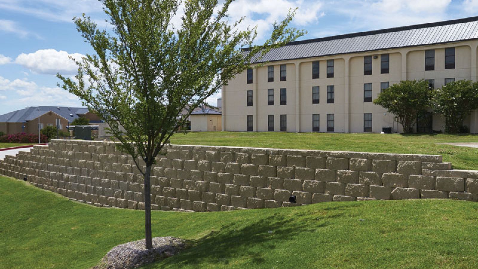 Valera® Pro Retaining Wall blocks by Keystone Hardscapes, emblematic of design perfection, showcased at AR Pools • Stoneworks & Outdoor Living.